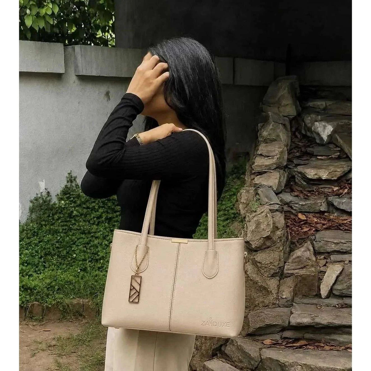  Model carrying Everyday Elegance Cream shoulder bag by Zaiduxe